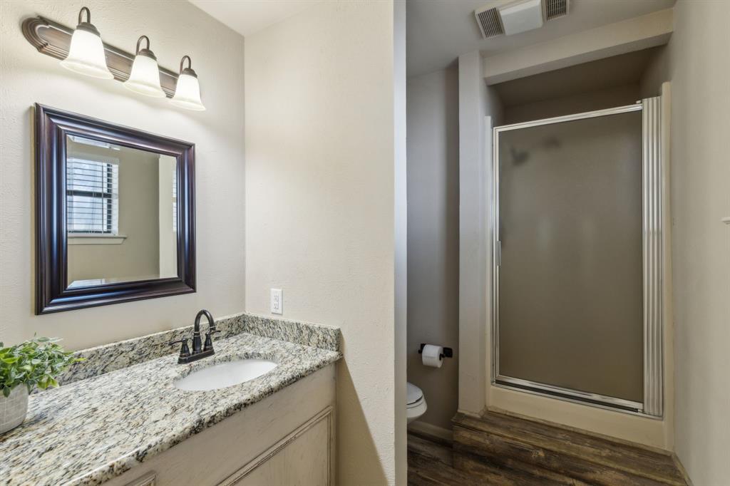 142 Peninsula Point Terrace Mabank, TX 75156 - Photo 13 of 29 a bathroom with a granite countertop sink and a mirror