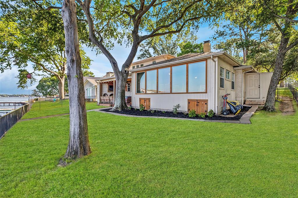 142 Peninsula Point Terrace Mabank, TX 75156 - Photo 21 of 29 a front view of house with yard and green space