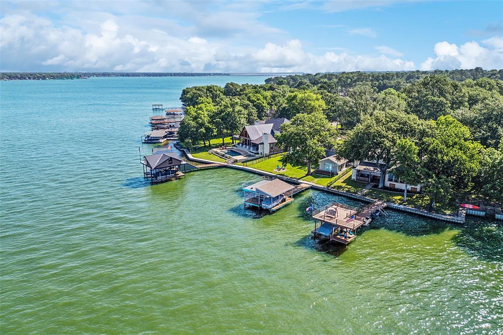 142 Peninsula Point Terrace Mabank, TX 75156 - Photo 25 of 29 a view of a swimming pool with lawn chairs and a yard