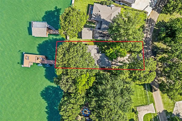 an aerial view of a house with a garden