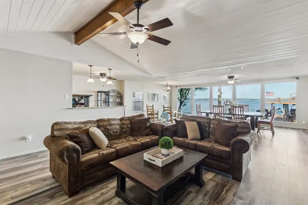 a large kitchen with stainless steel appliances granite countertop a stove and cabinets