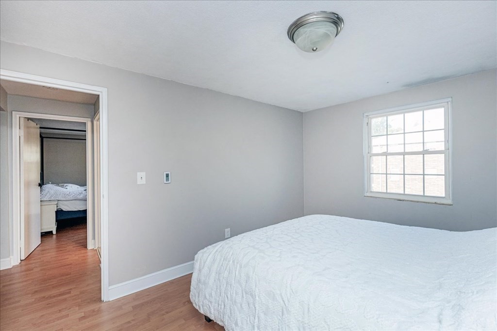 7 Walker Road, Unit 9 North Andover, MA 01845 - Photo 17 of 23 a bedroom with a bed and window