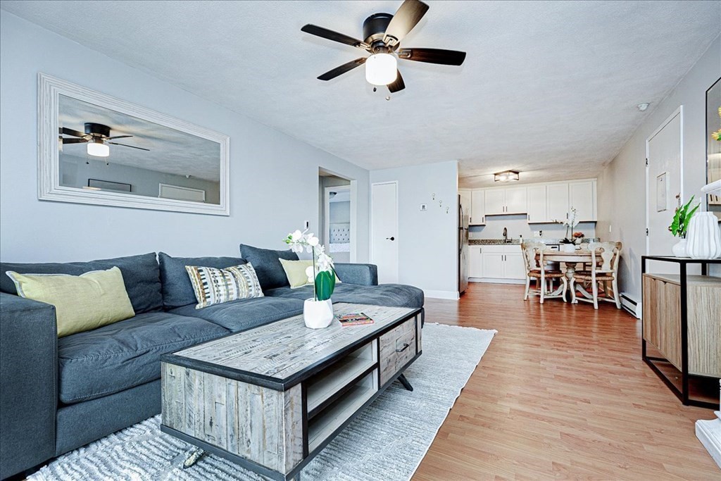 7 Walker Road, Unit 9 North Andover, MA 01845 - Photo 7 of 23 a living room with furniture and a table