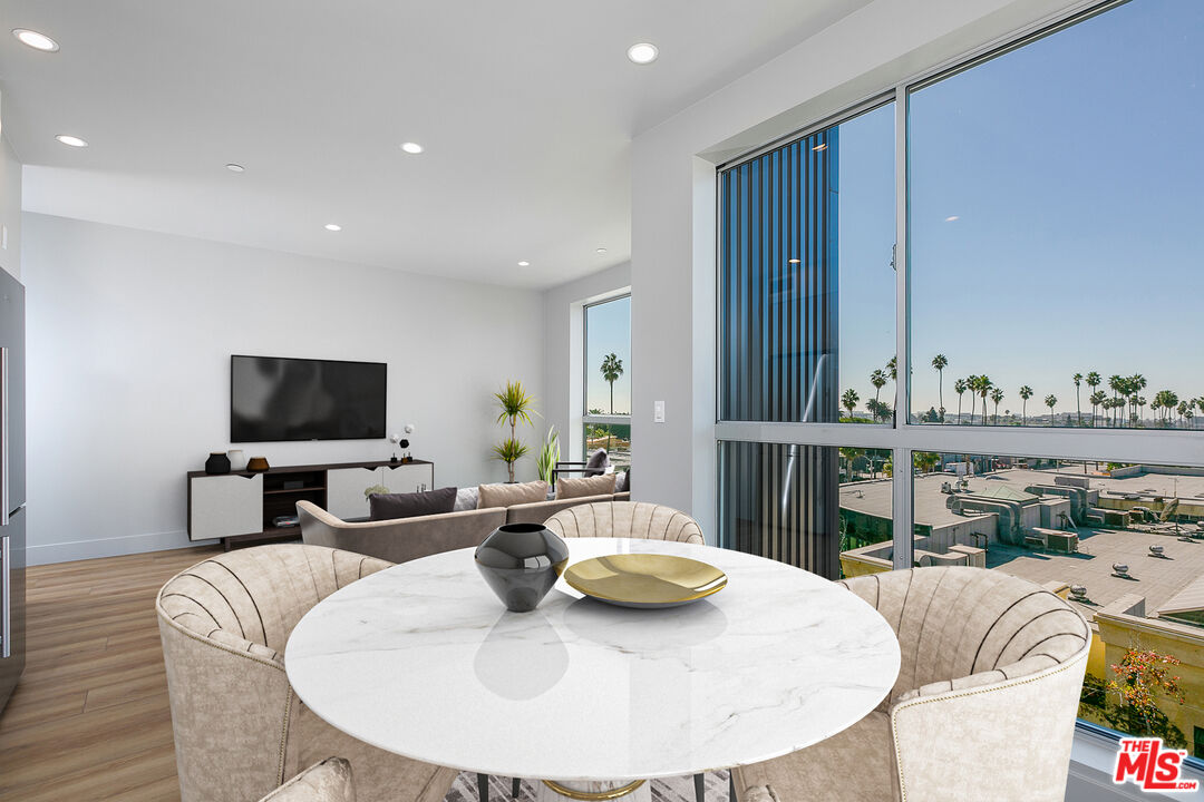 12431 Rochester Avenue, Unit 206 Los Angeles, CA 90025 - Photo 5 of 23 a living room with furniture and a flat screen tv