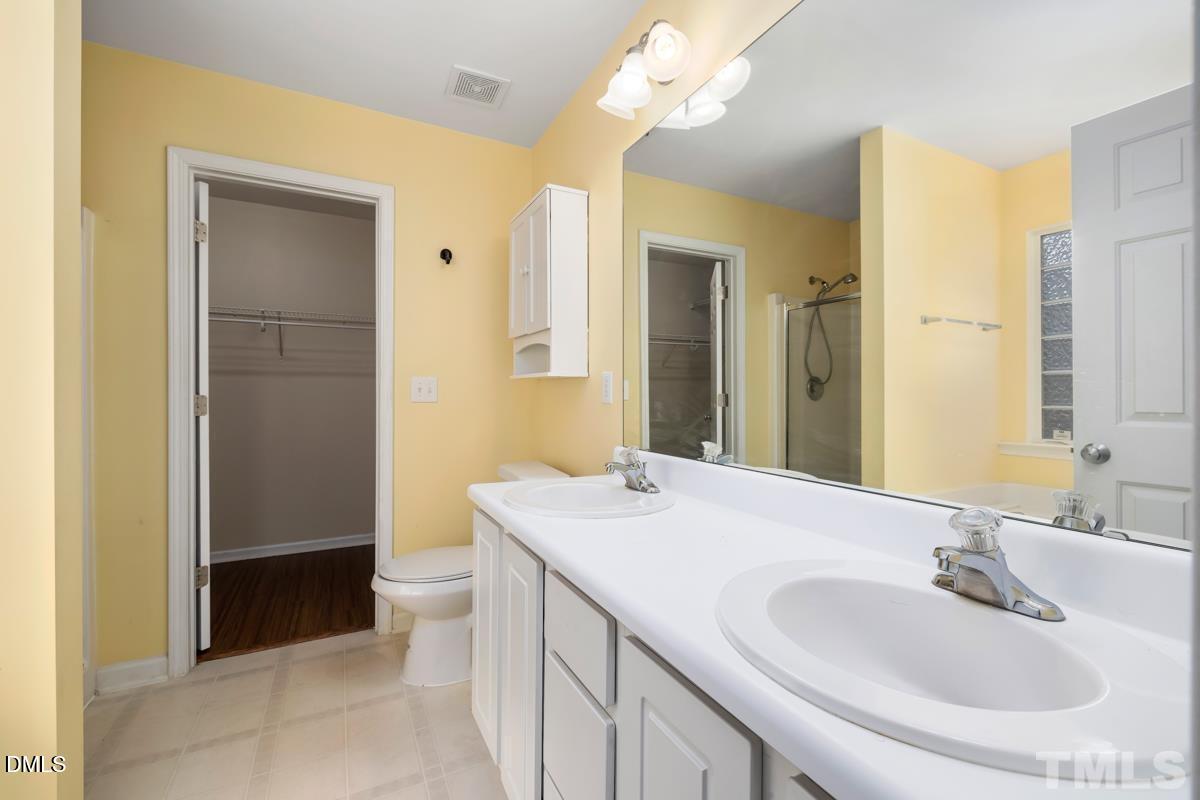 3617 Hamilton Mill Drive Raleigh, NC 27616 - Photo 12 of 20 a bathroom with a sink a toilet and shower