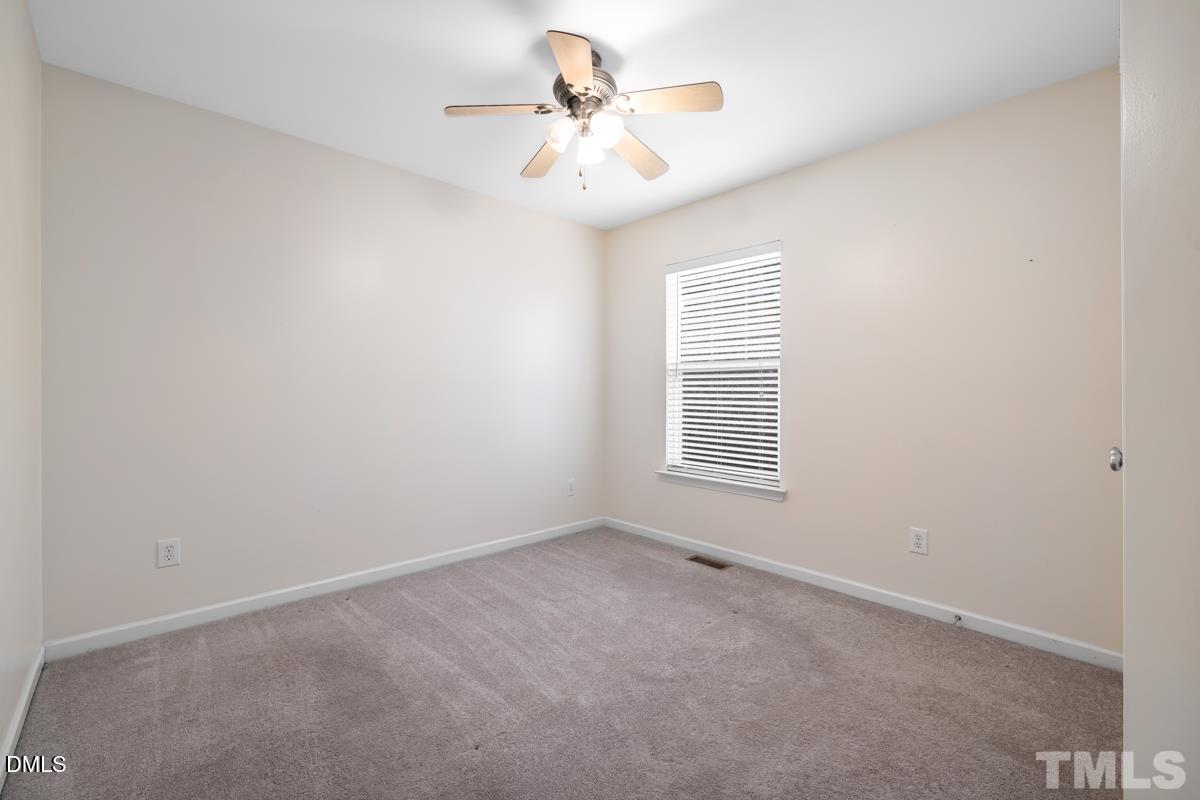 3617 Hamilton Mill Drive Raleigh, NC 27616 - Photo 15 of 20 a view of a room with windows and ceiling fan