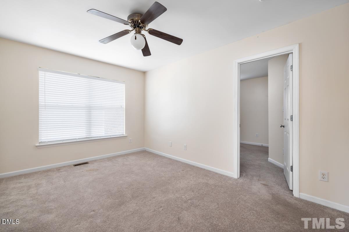 3617 Hamilton Mill Drive Raleigh, NC 27616 - Photo 18 of 20 a view of an empty room with a window