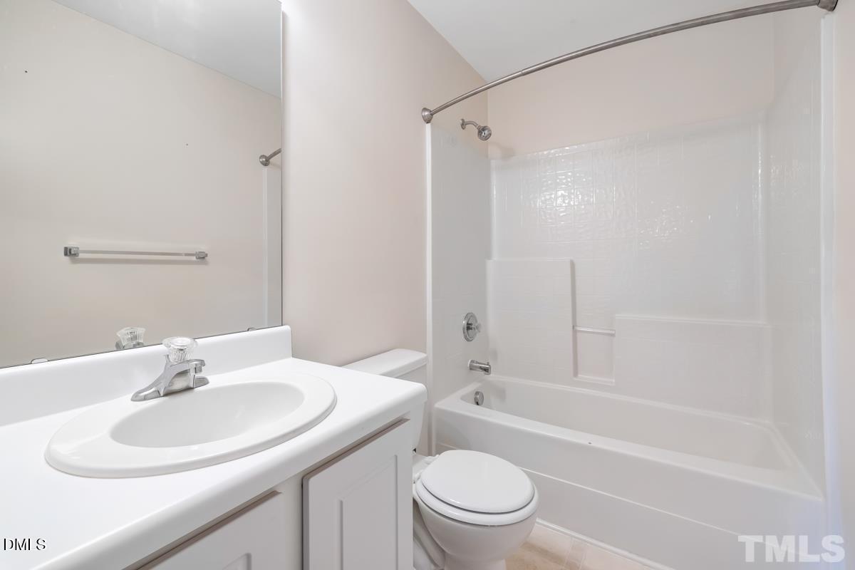 3617 Hamilton Mill Drive Raleigh, NC 27616 - Photo 19 of 20 a bathroom with a sink toilet and shower