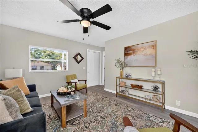 a living room with furniture and a rug