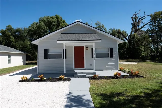 front view of a house with a yard