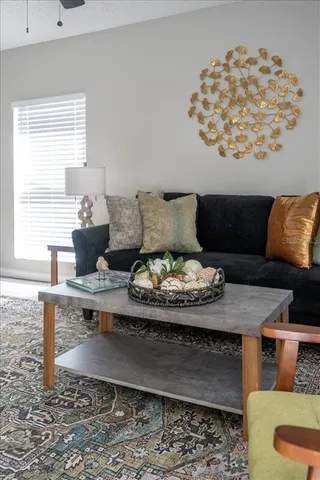 a living room with furniture and window