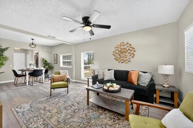 a living room with furniture and a large window