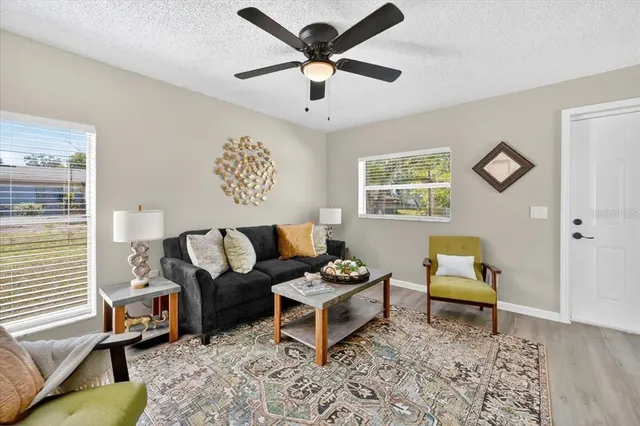 a living room with furniture and a window