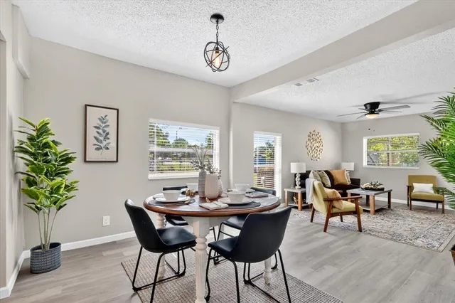 a view of a dining room with furniture window and outside view