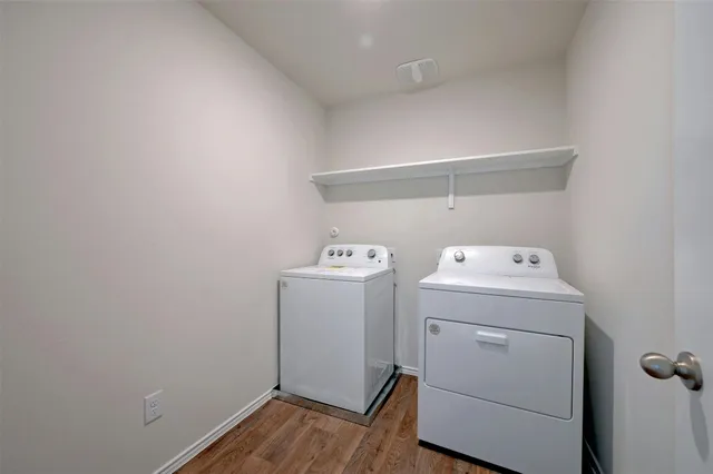 a bathroom with a granite countertop sink a toilet a mirror a bathtub and shower