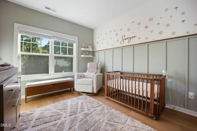 a bathroom with a bathtub and a window