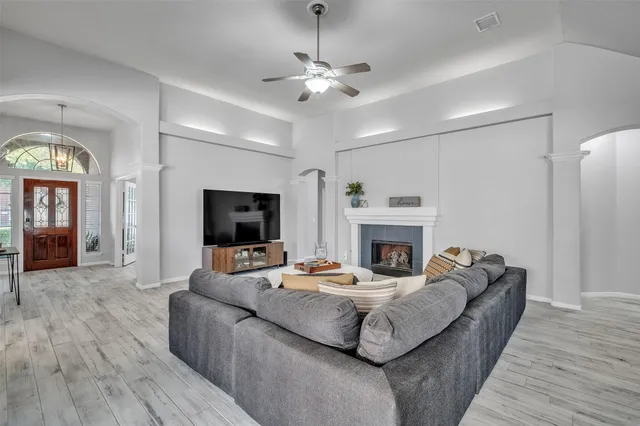 a living room with furniture and a fireplace