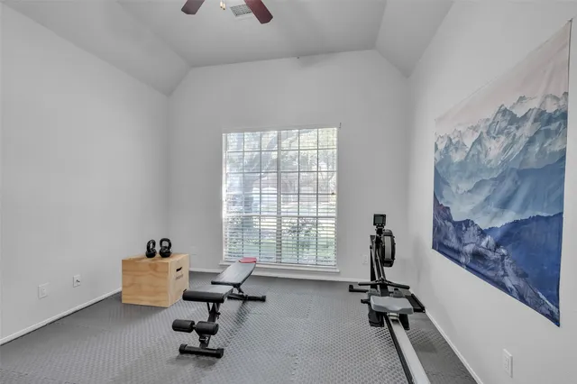 a view of a livingroom with workspace and a window