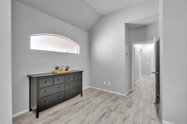 a view of room with wooden floor