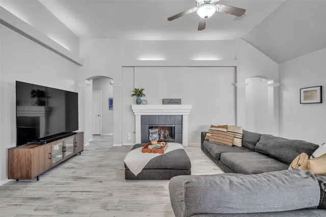 a living room with furniture and a flat screen tv
