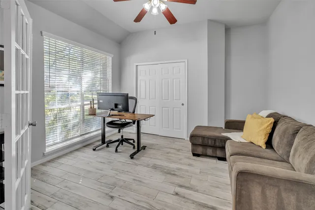a living room with furniture and a window
