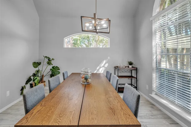 a bed room with a bed and a chandelier