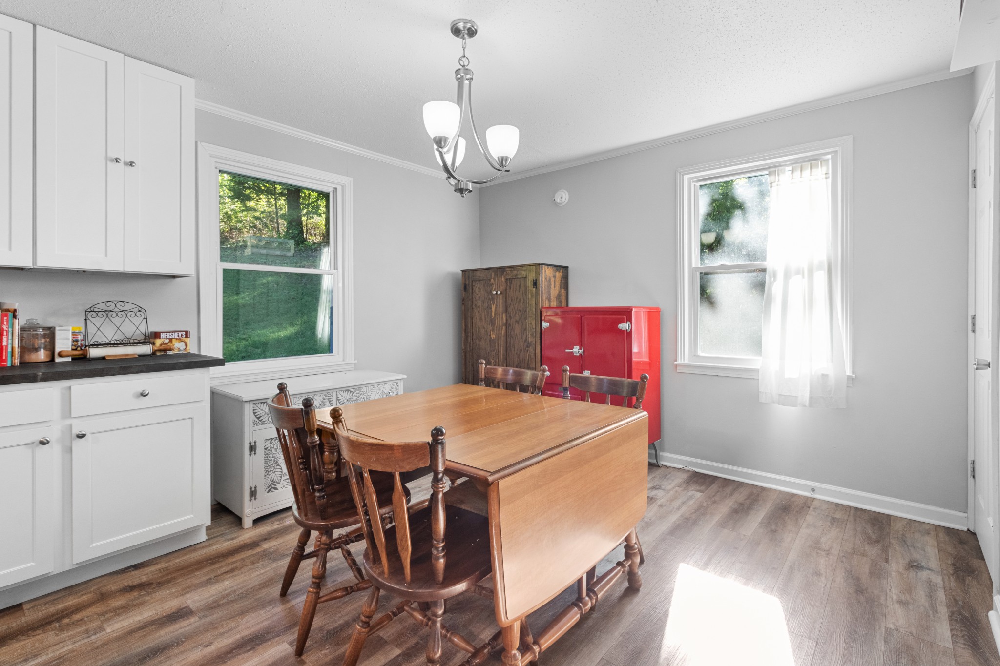 684 Dean Road Clarksville, TN 37040 - Photo 14 of 35 a dining room with furniture a window and wooden floor