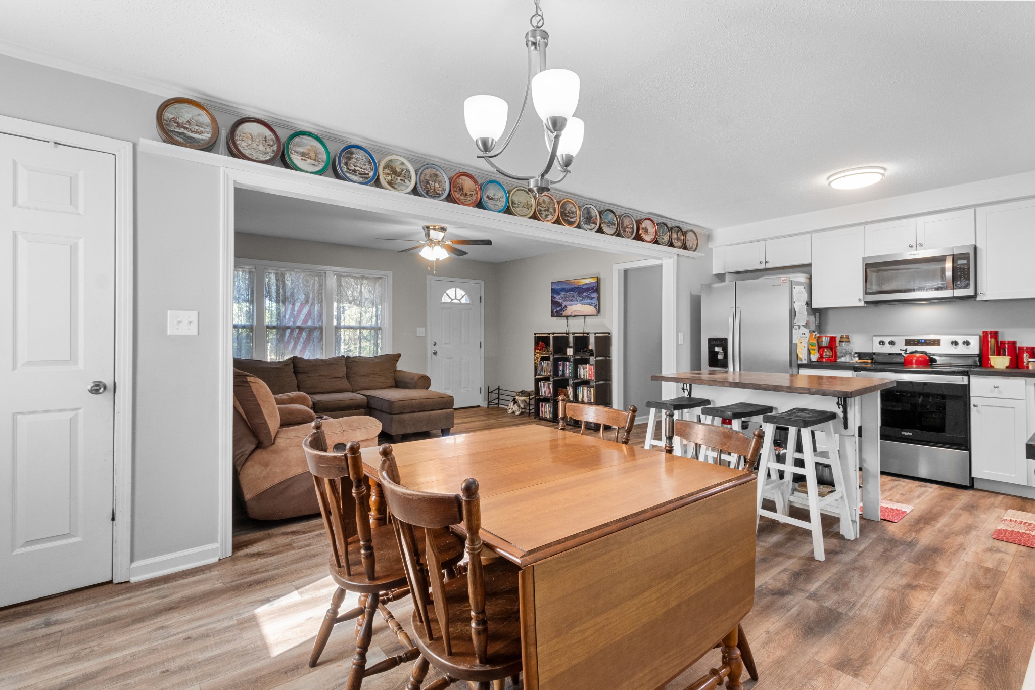 684 Dean Road Clarksville, TN 37040 - Photo 16 of 35 a view of a dining room with furniture and wooden floor