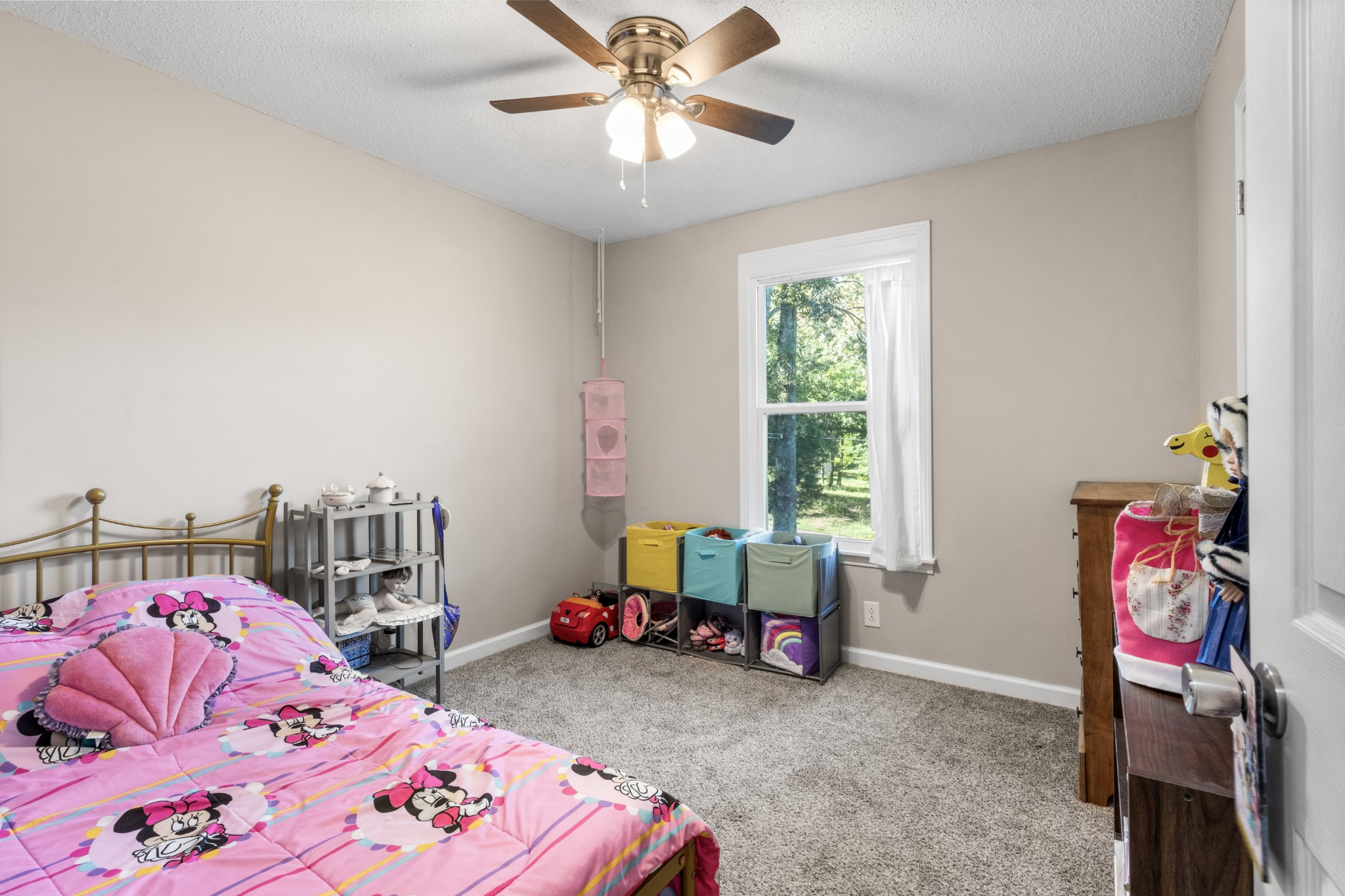 684 Dean Road Clarksville, TN 37040 - Photo 17 of 35 a bedroom with a bed and a chandelier