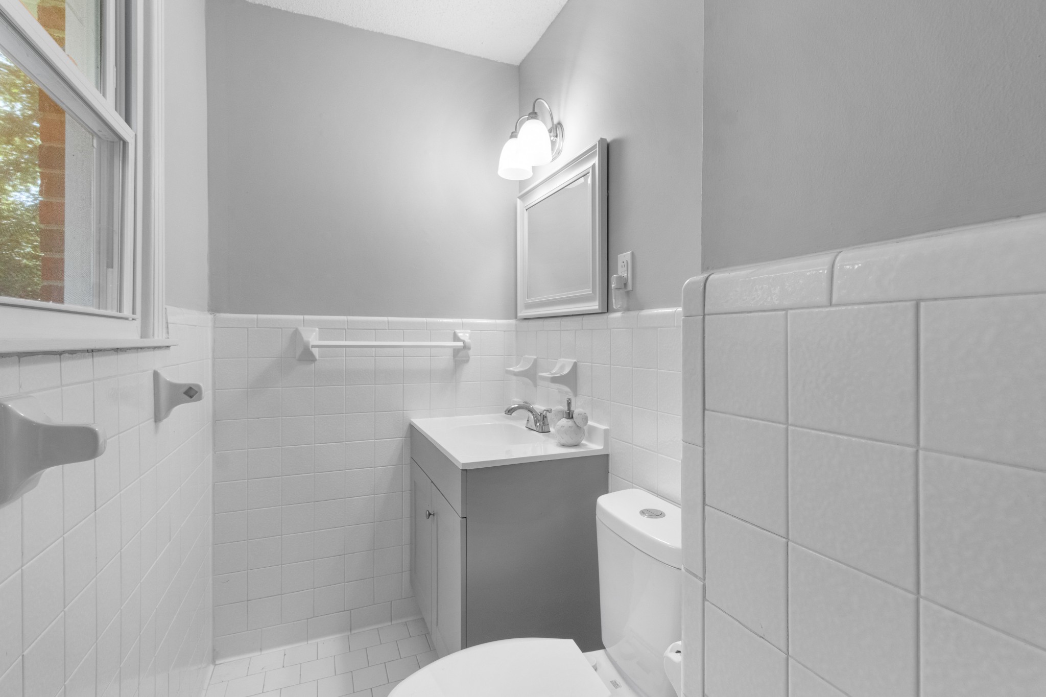 684 Dean Road Clarksville, TN 37040 - Photo 23 of 35 a bathroom with a sink a toilet and a mirror