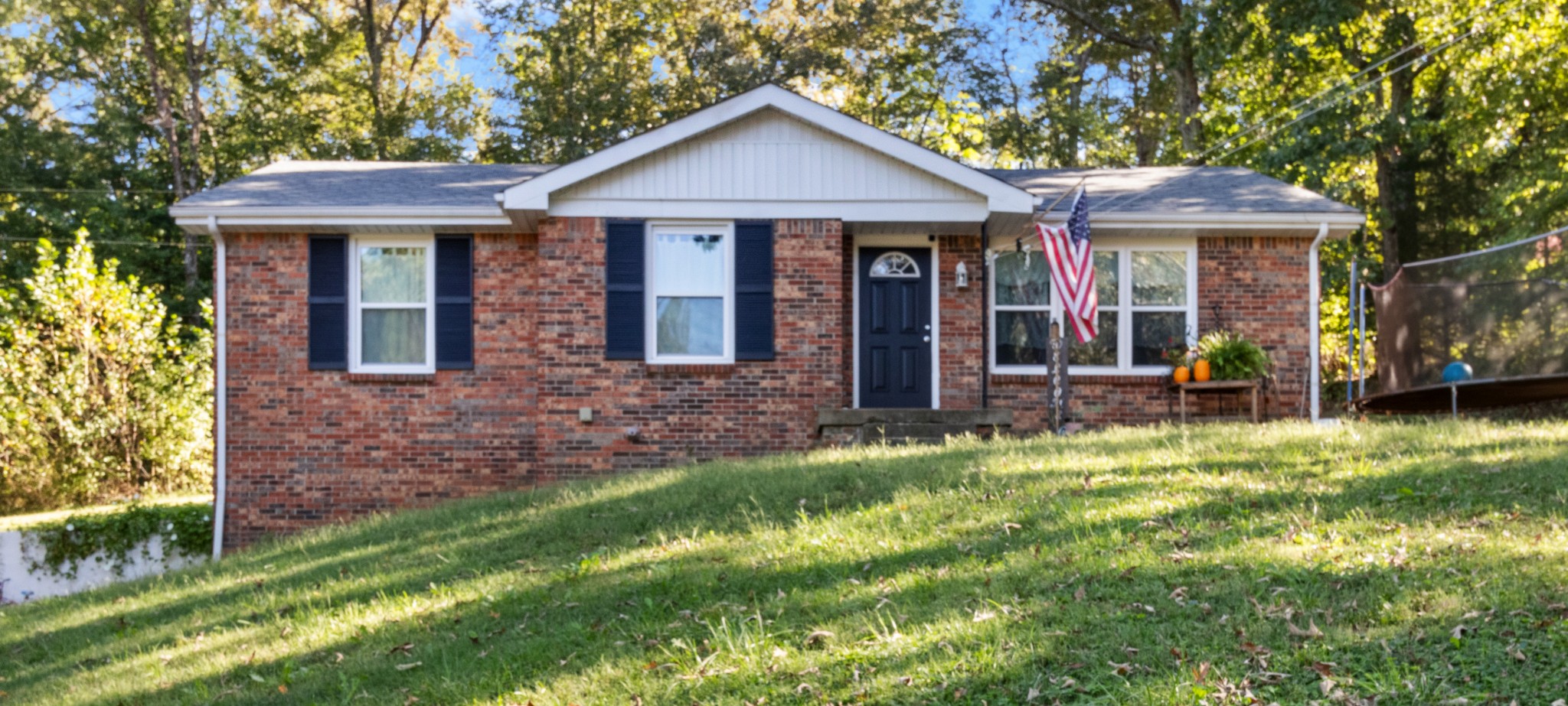 684 Dean Road Clarksville, TN 37040 - Photo 3 of 35 a front view of a house with a yard table and chairs