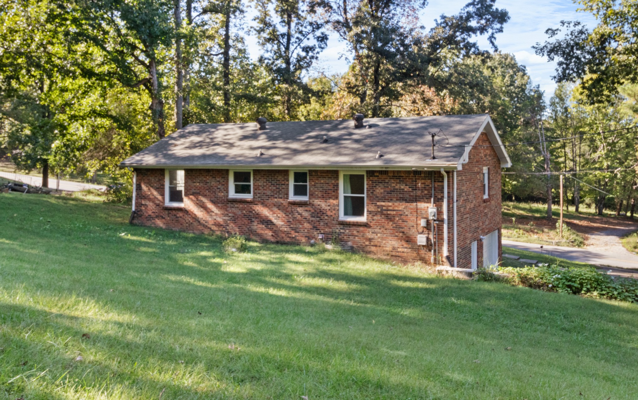 684 Dean Road Clarksville, TN 37040 - Photo 34 of 35 a view of a house with a yard potted plants and large tree