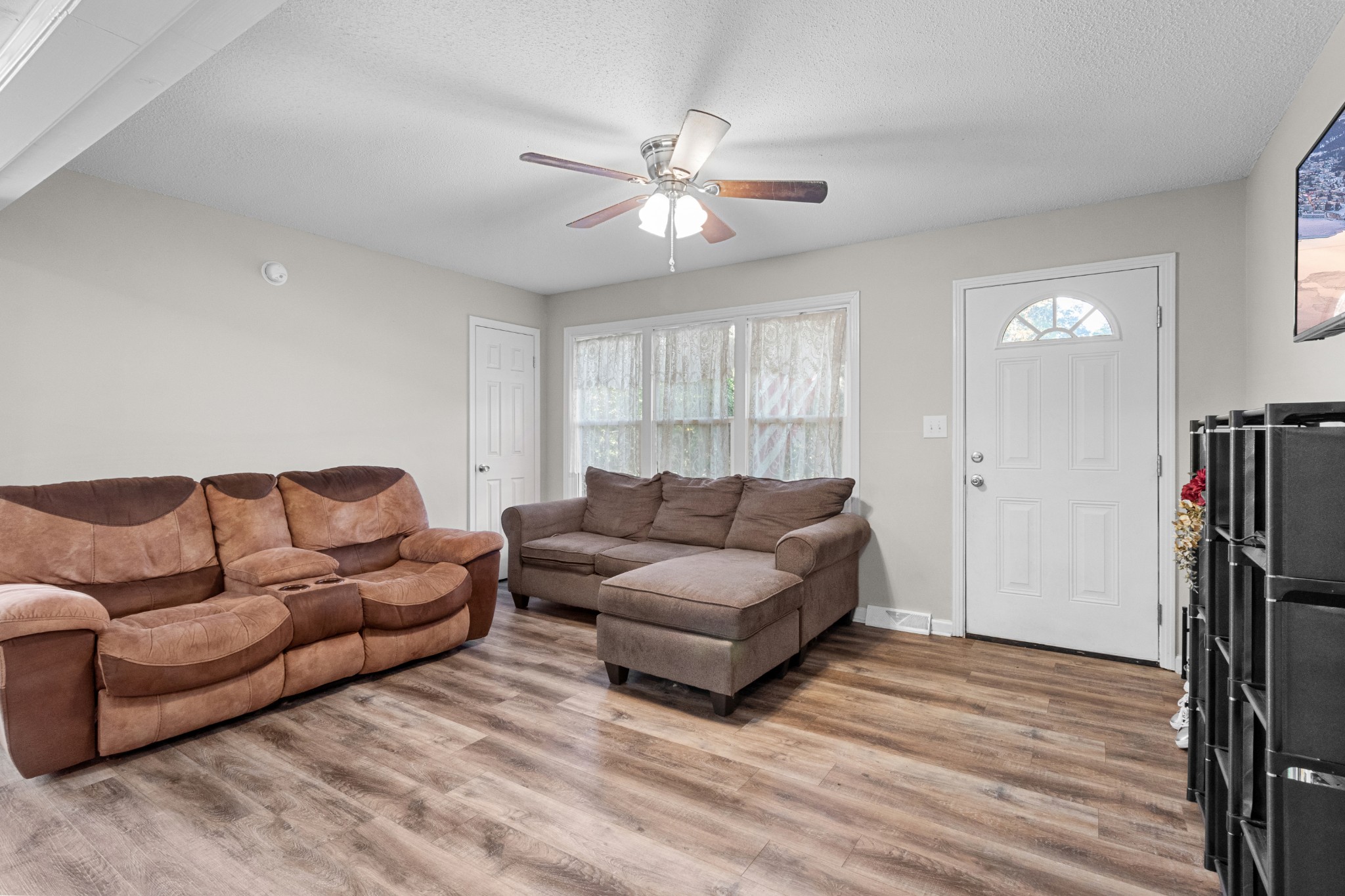 684 Dean Road Clarksville, TN 37040 - Photo 10 of 35 a living room with furniture and a ceiling fan