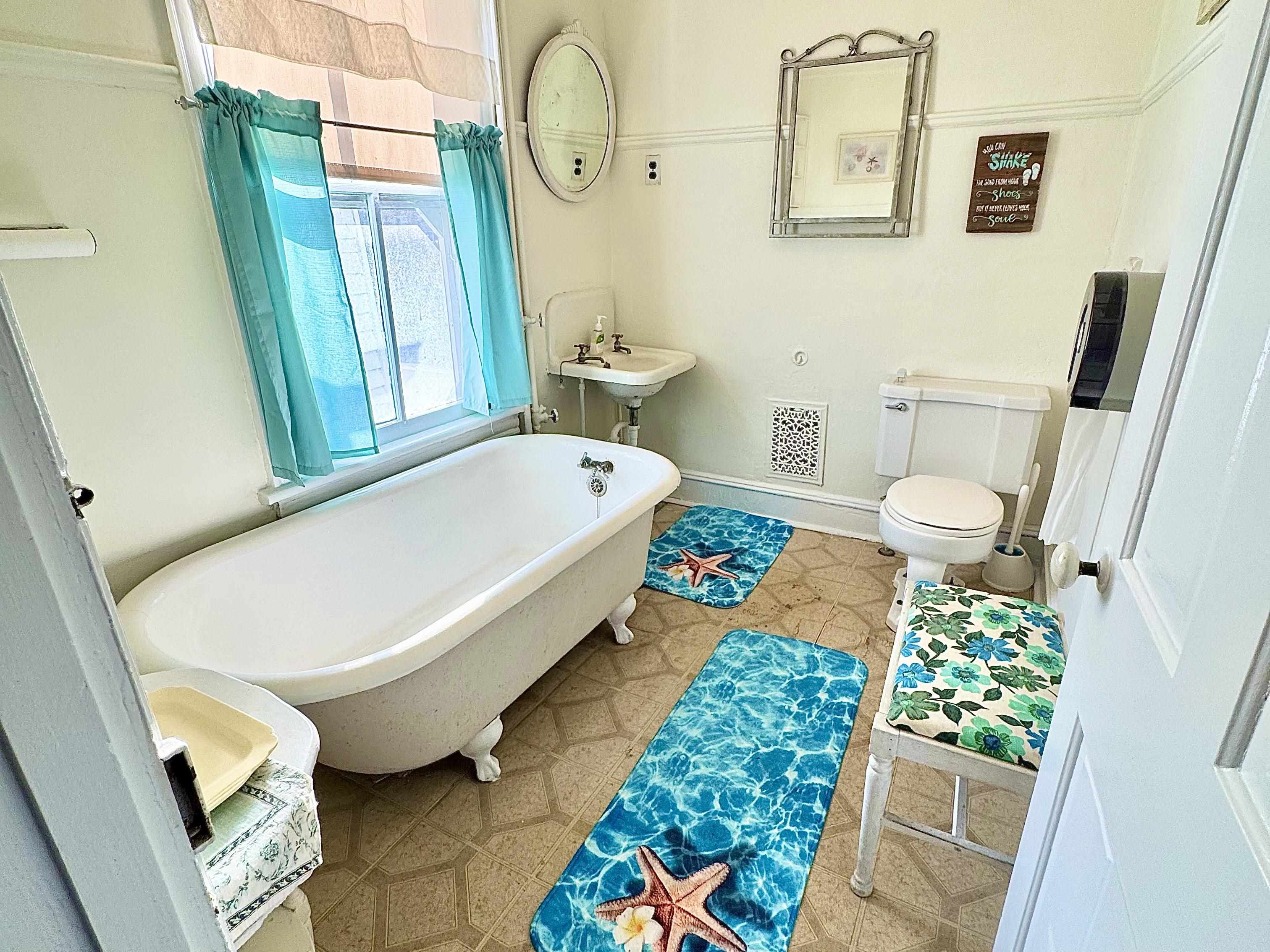 202 Perry Street Cape May, NJ 08204 - Photo 18 of 49 a bathroom with a sink mirror vanity and toilet
