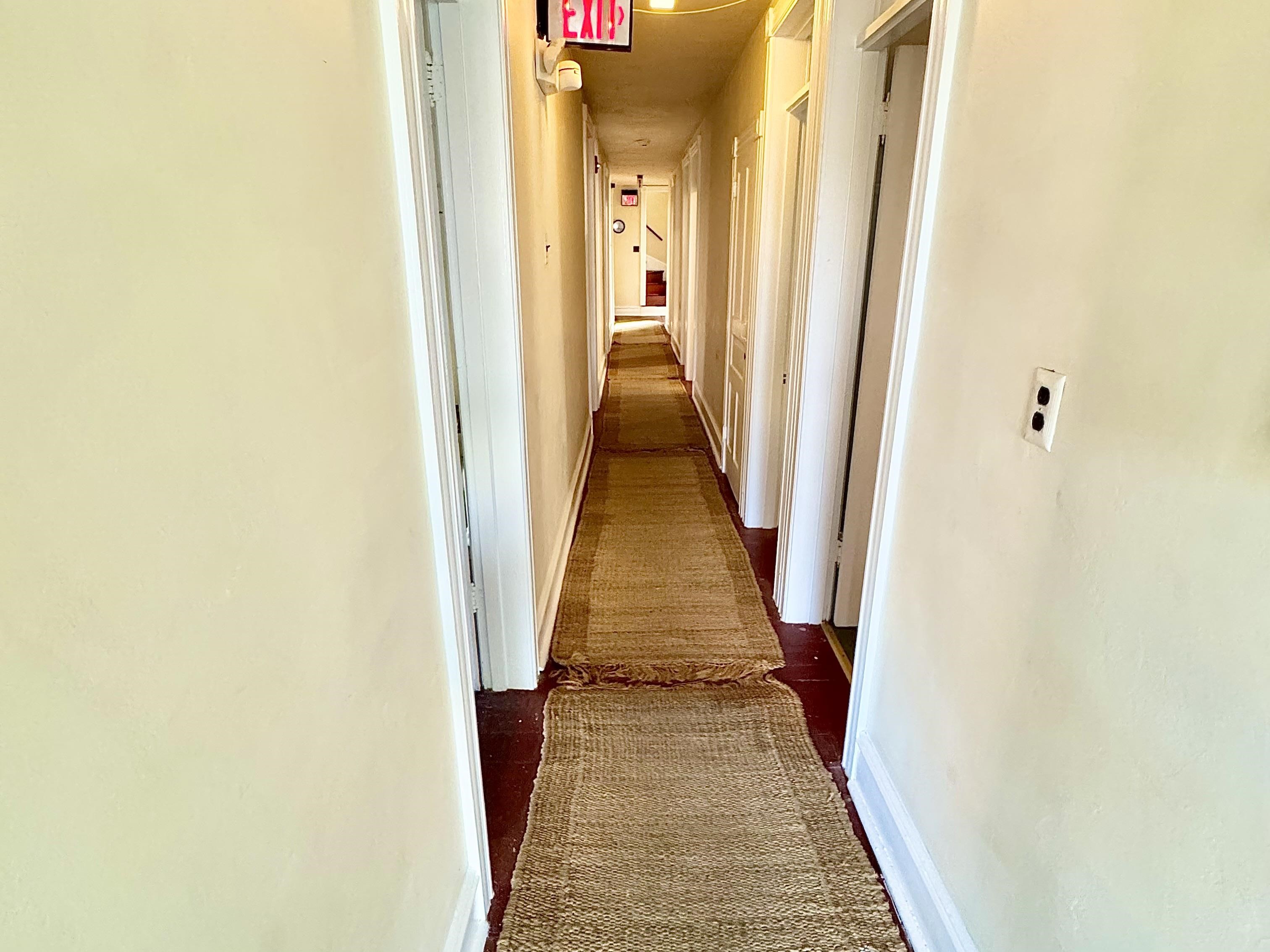 202 Perry Street Cape May, NJ 08204 - Photo 20 of 49 a view of a hallway with wooden floor and stairs
