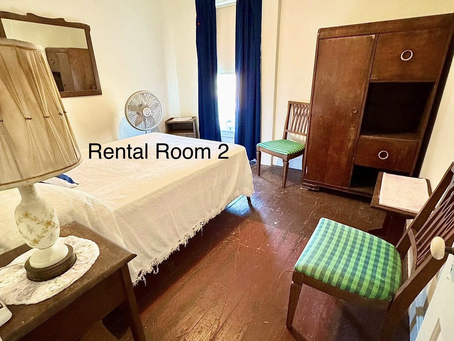 202 Perry Street Cape May, NJ 08204 - Photo 23 of 49 a bed sitting in a bedroom next to a window