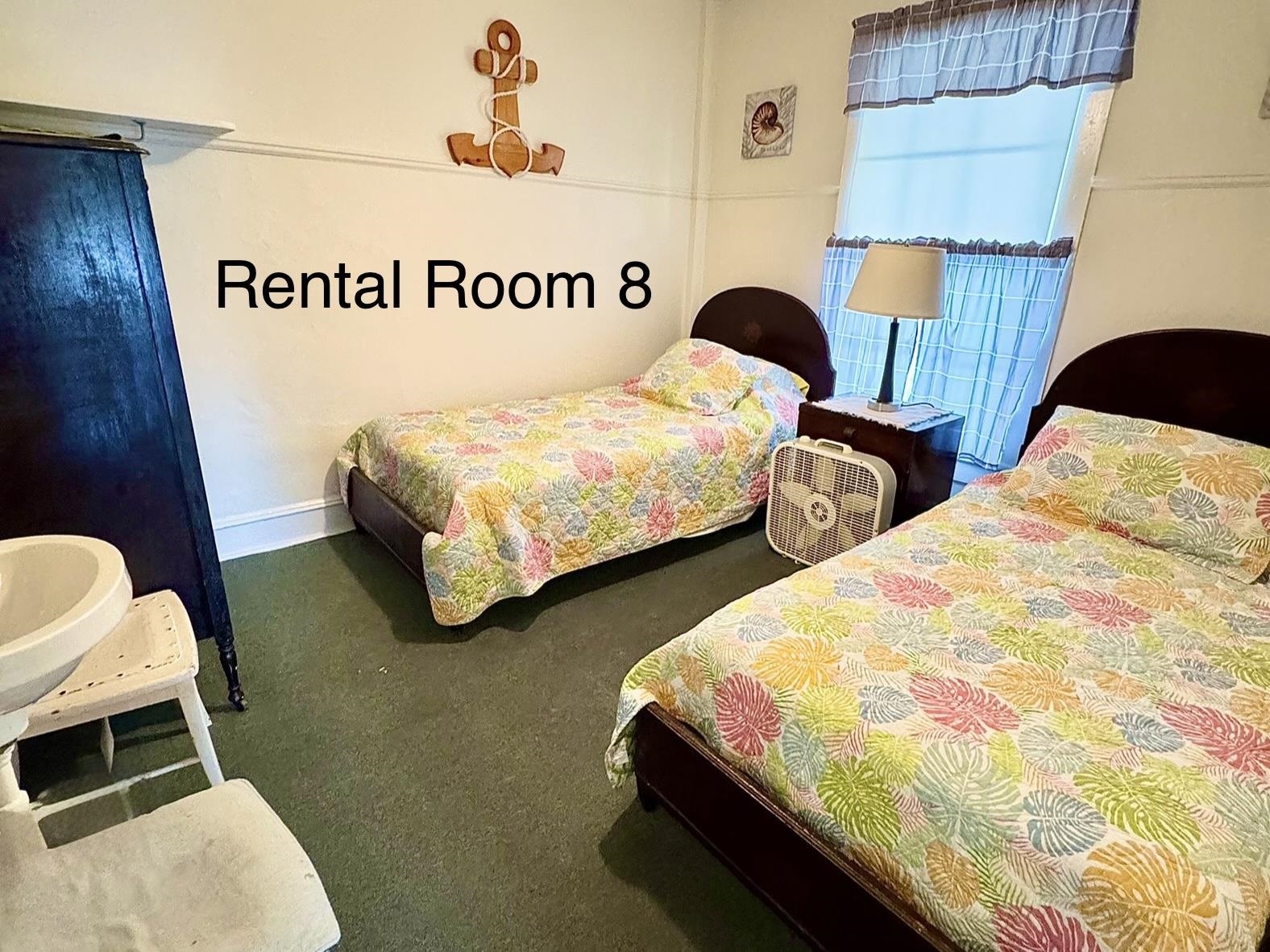 202 Perry Street Cape May, NJ 08204 - Photo 29 of 49 a bedroom with two bed and a window