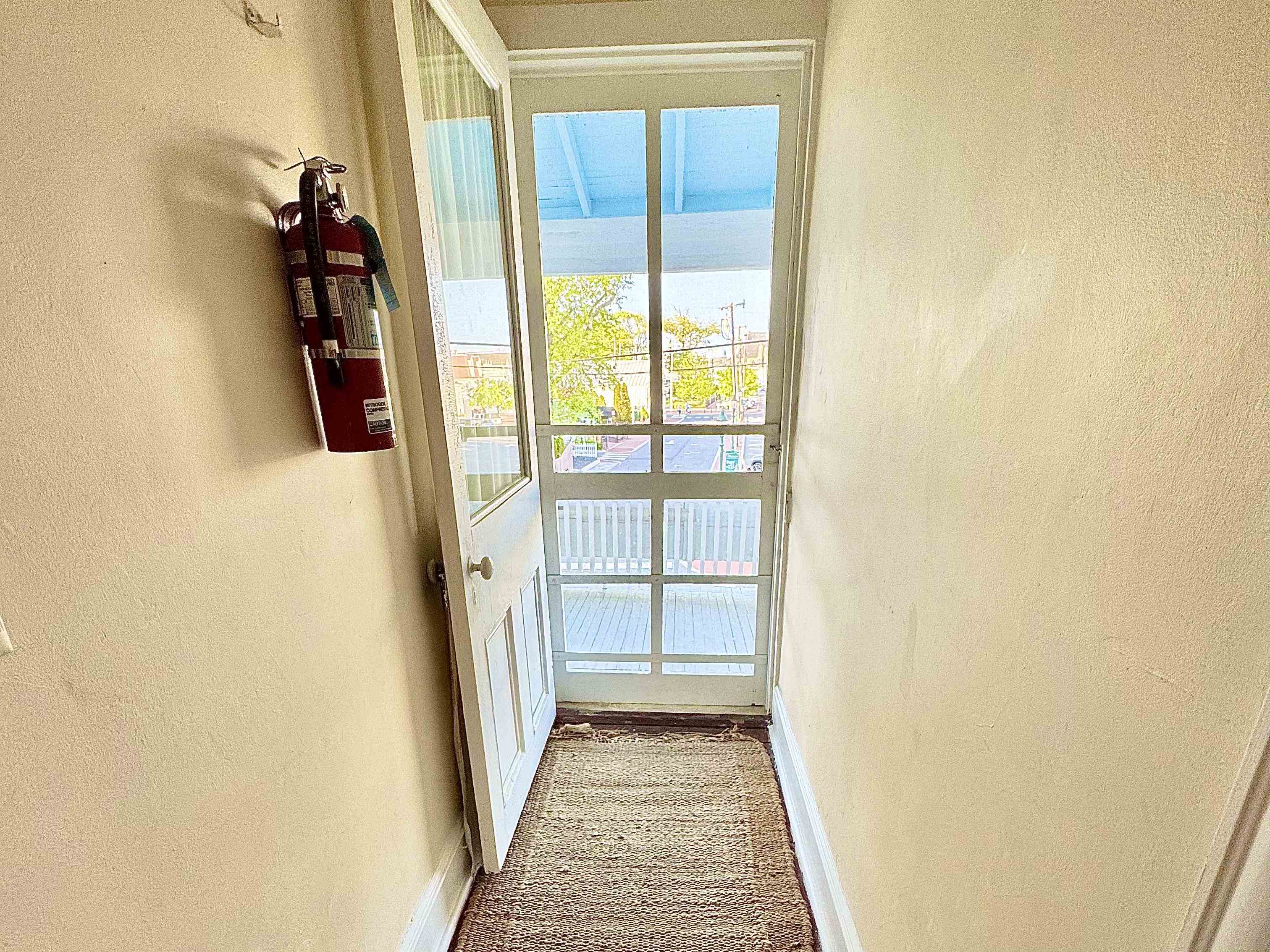 202 Perry Street Cape May, NJ 08204 - Photo 30 of 49 a view of a hallway with wooden floor and entryway
