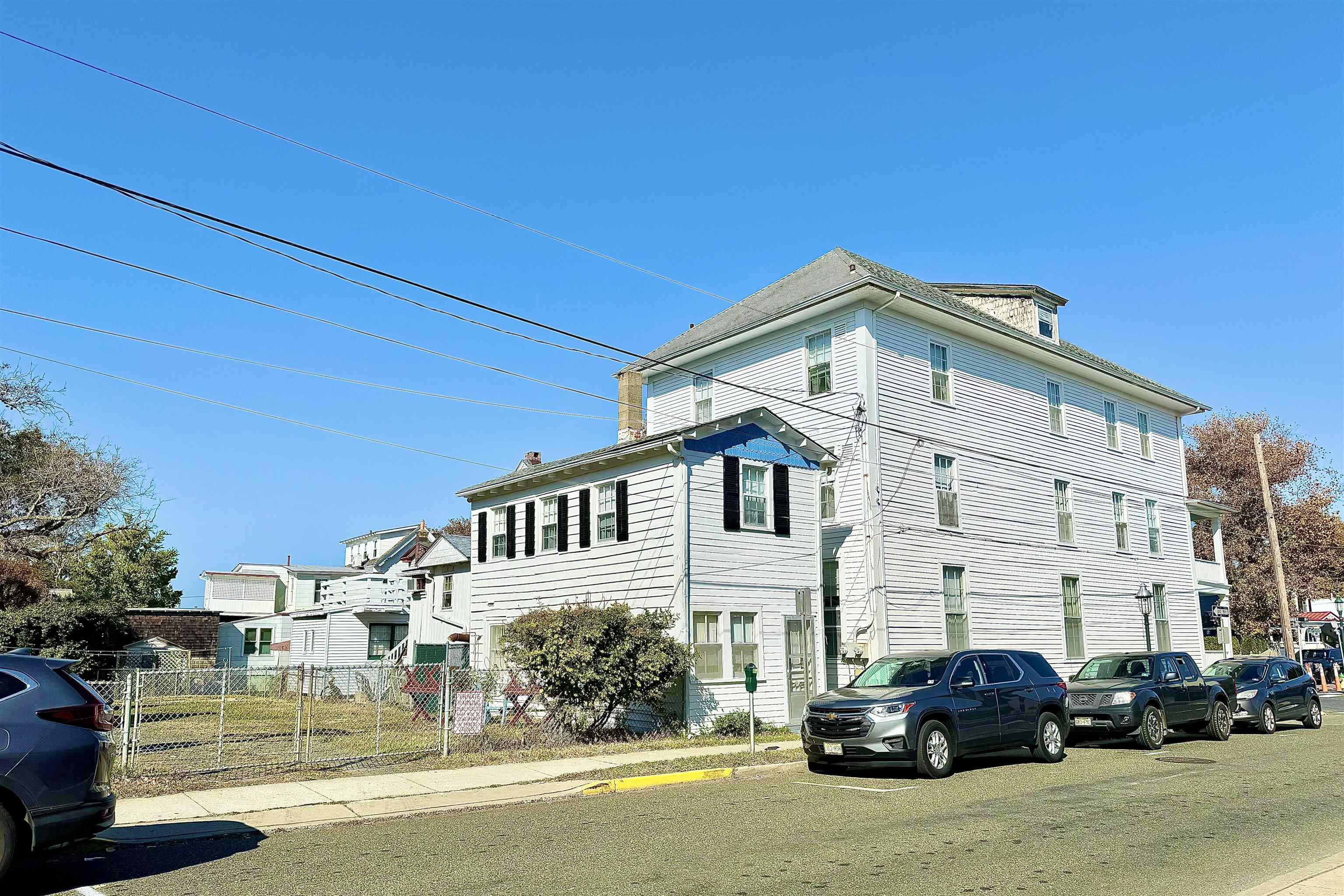202 Perry Street Cape May, NJ 08204 - Photo 3 of 49 a front view of a building with cars parked