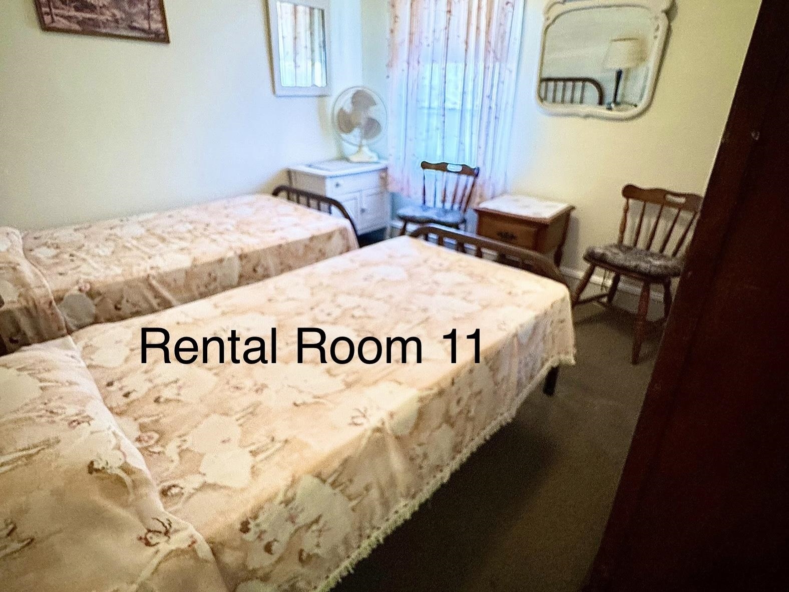 202 Perry Street Cape May, NJ 08204 - Photo 35 of 49 a bed sitting in a bedroom next to a window