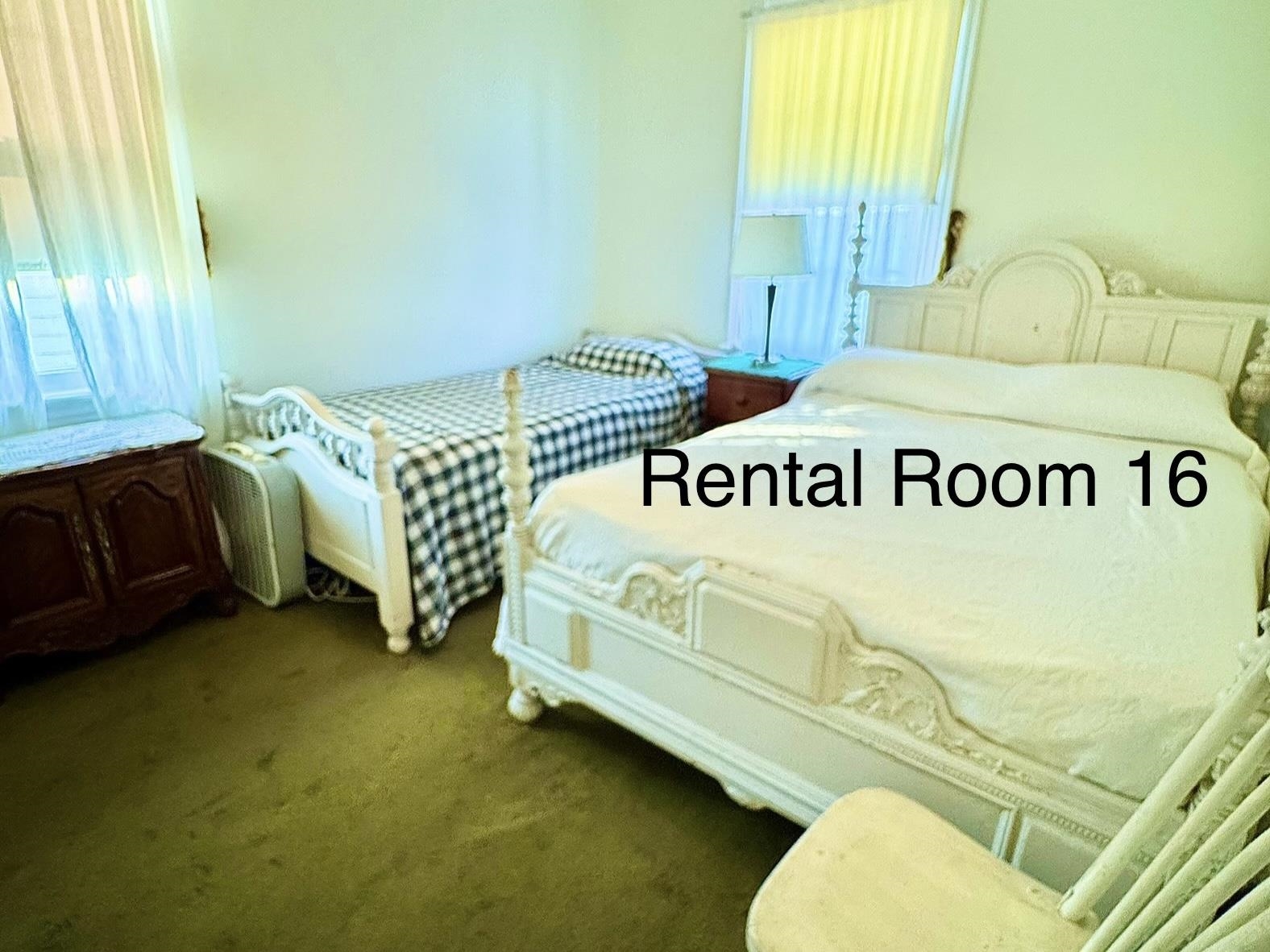 202 Perry Street Cape May, NJ 08204 - Photo 37 of 49 a bedroom with a bed and window