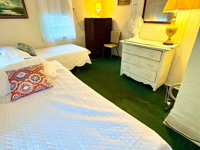 a living room with couches chairs and a fireplace