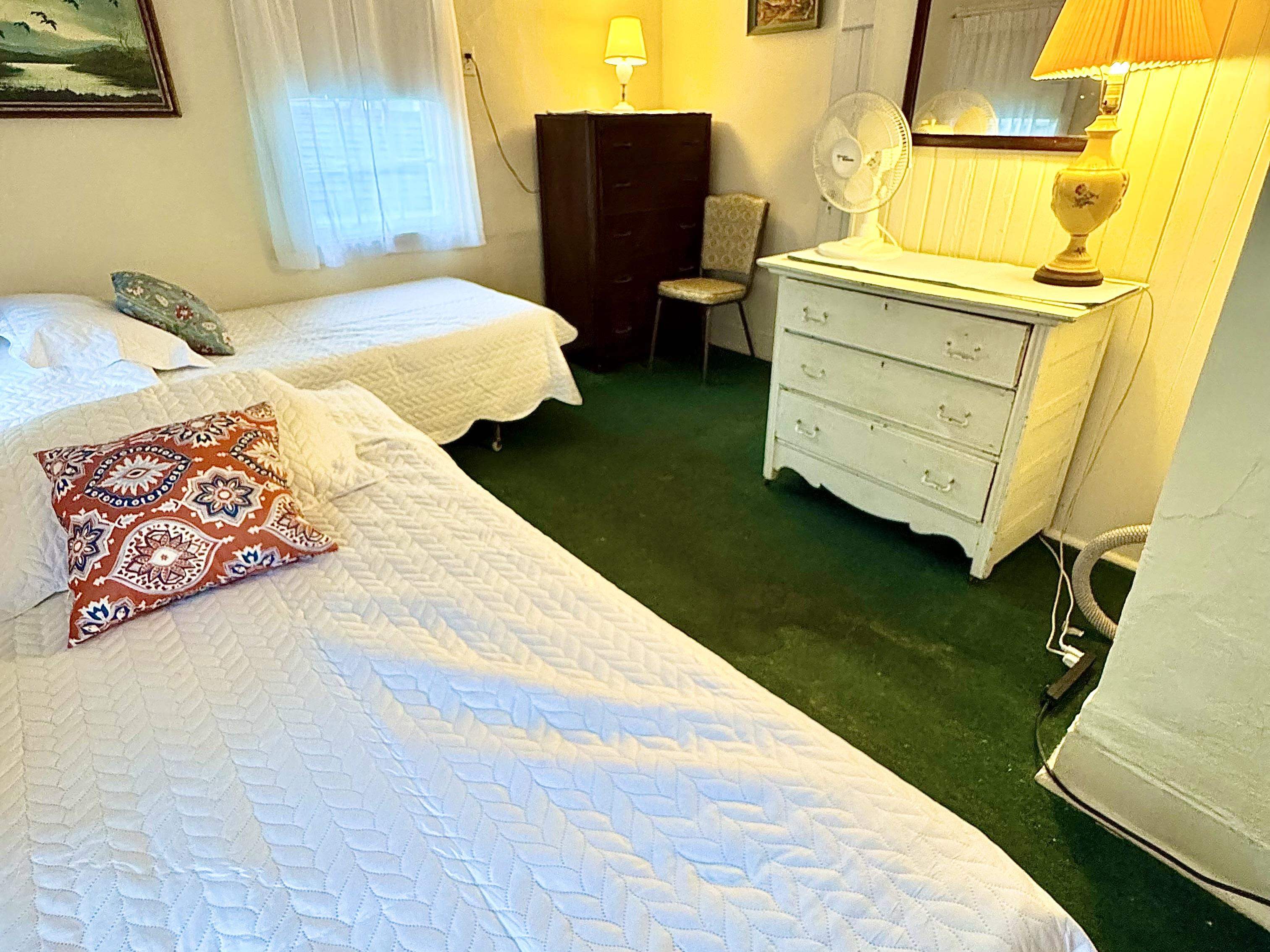 202 Perry Street Cape May, NJ 08204 - Photo 47 of 49 a bedroom with a bed and wooden floor