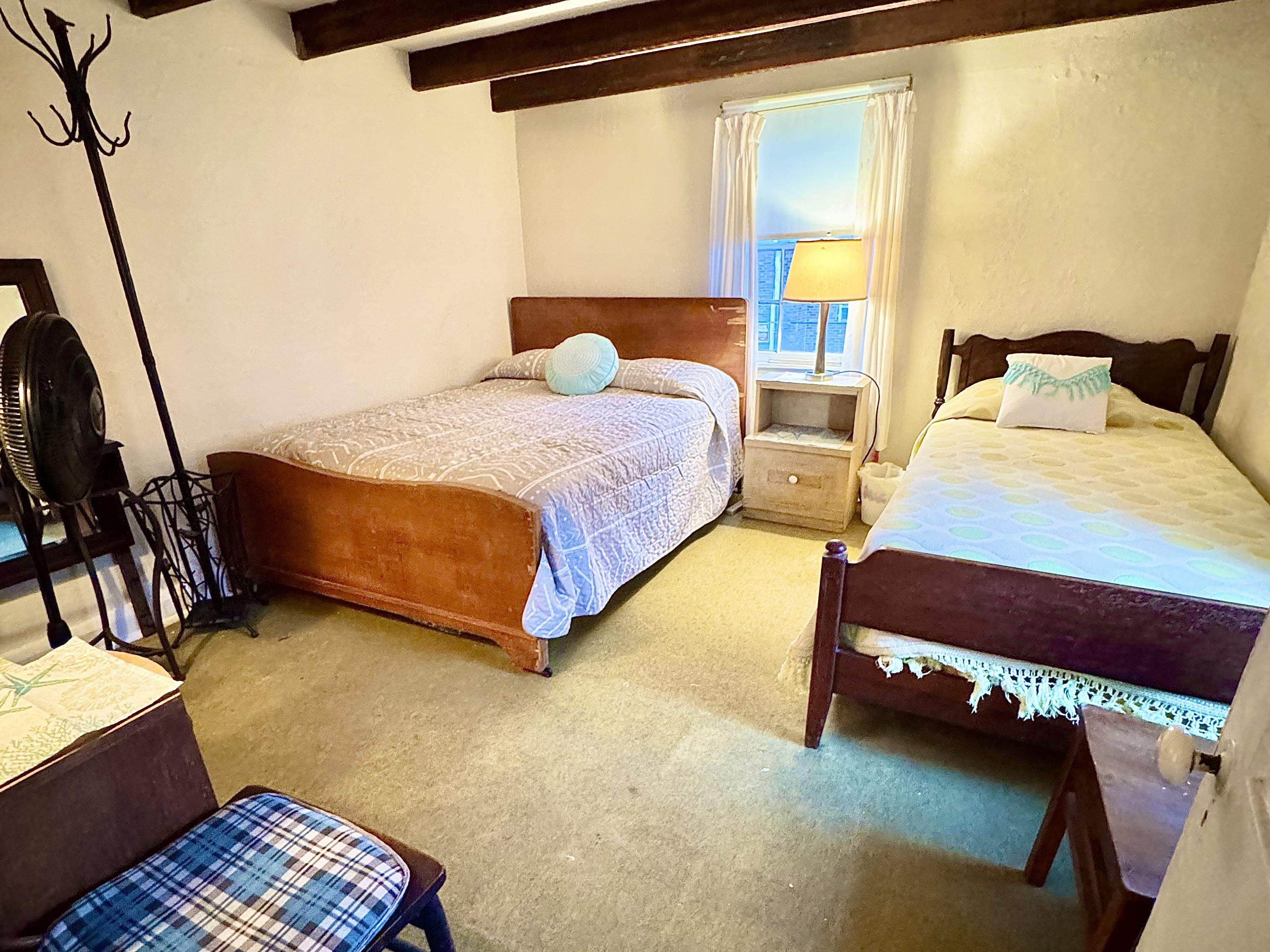 202 Perry Street Cape May, NJ 08204 - Photo 48 of 49 a bedroom with a bed and wooden floor