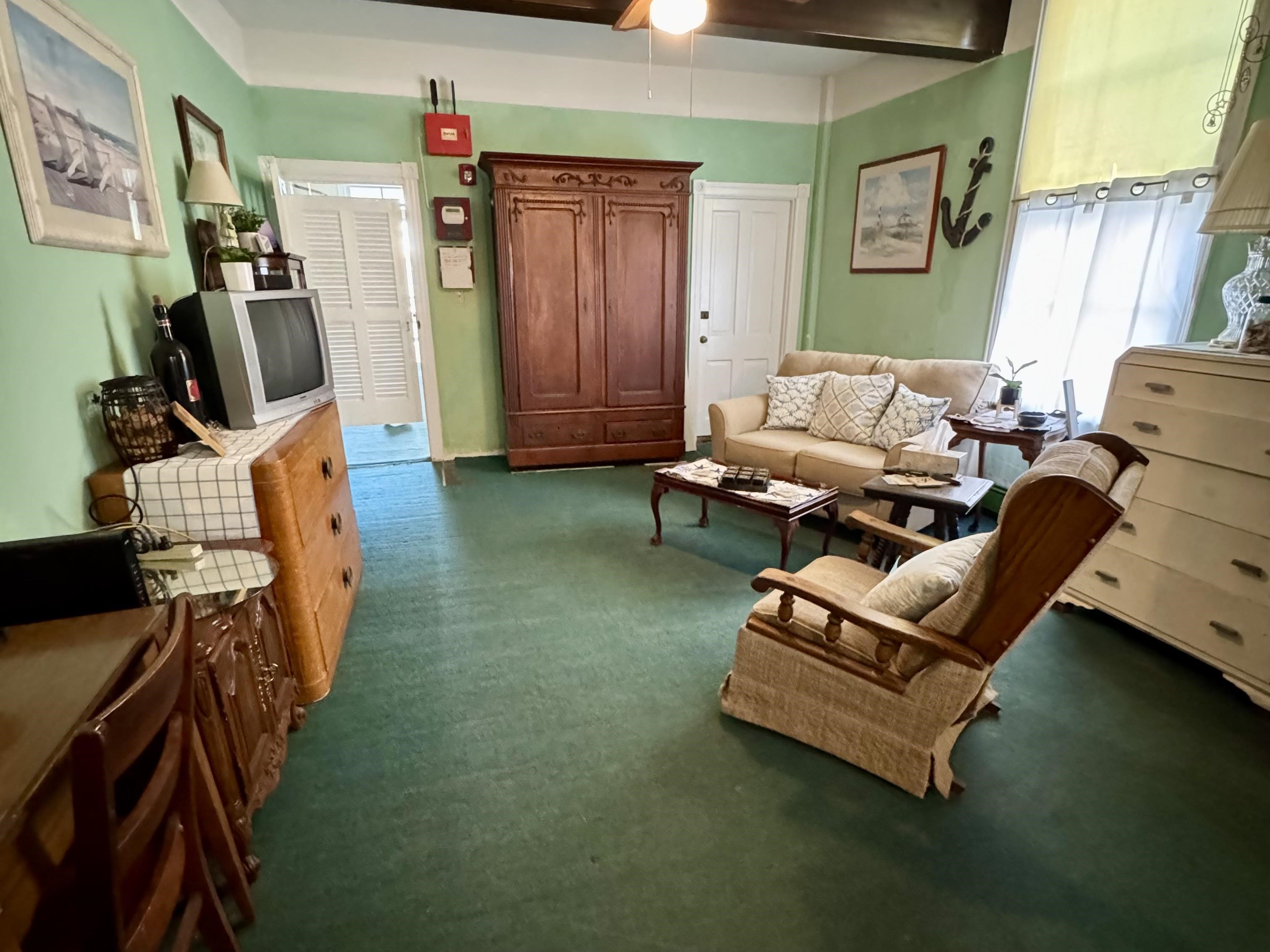 202 Perry Street Cape May, NJ 08204 - Photo 8 of 49 a living room with furniture and a flat screen tv