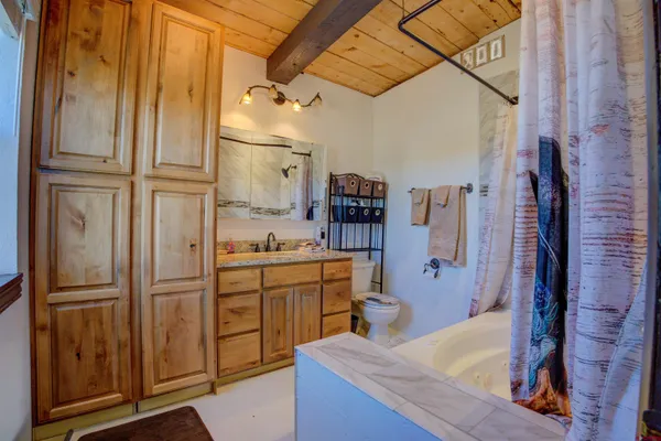 a kitchen with stainless steel appliances granite countertop a refrigerator and a stove