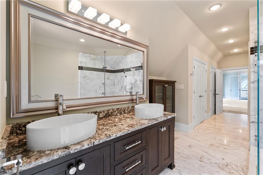 14560 Wood Road Milton, GA 30004 - Photo 32 of 74 a bathroom with a granite countertop sink and a mirror