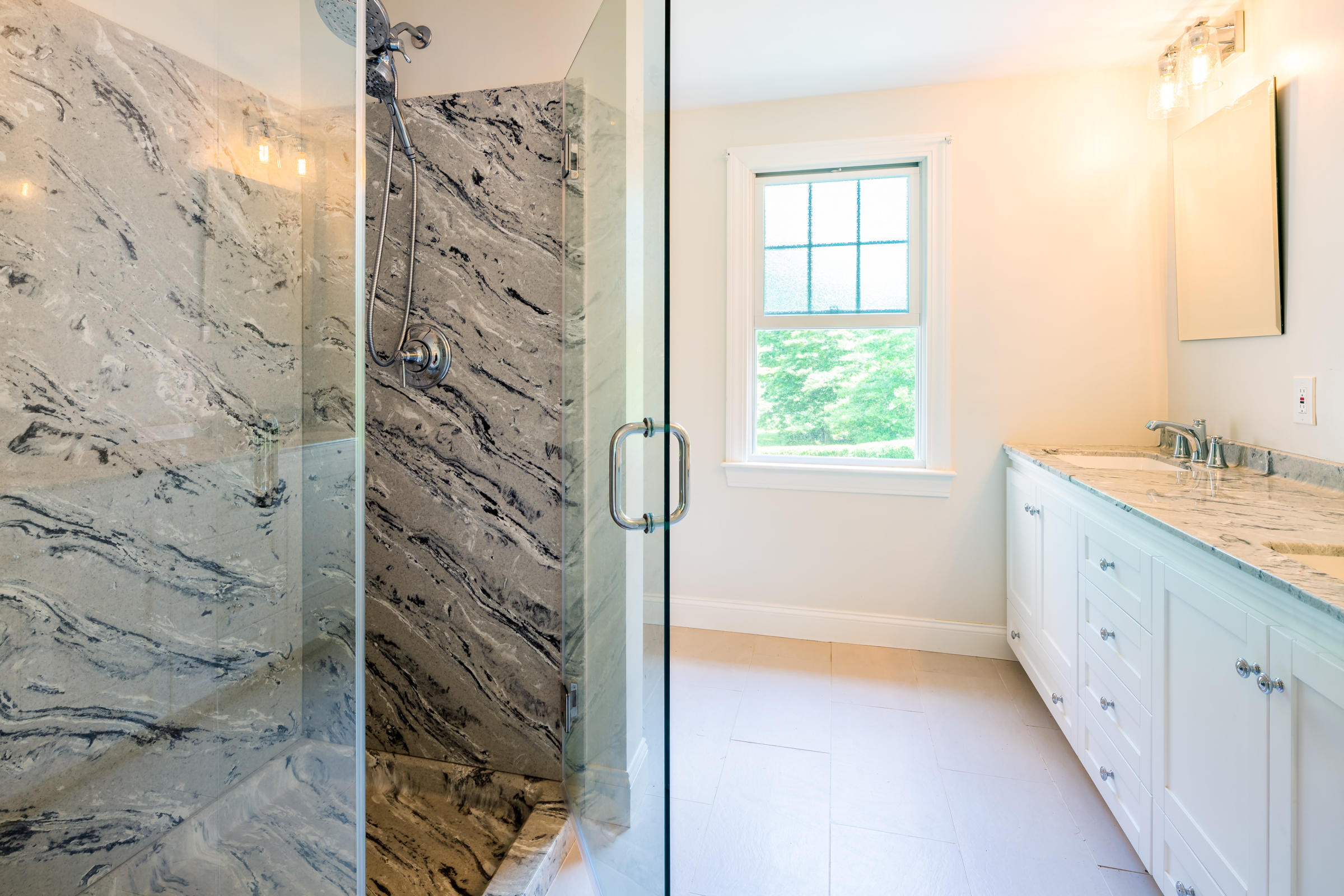 78 Wareham Road Marion, MA 02738 - Photo 31 of 47 a bathroom with a granite countertop sink a shower and a window