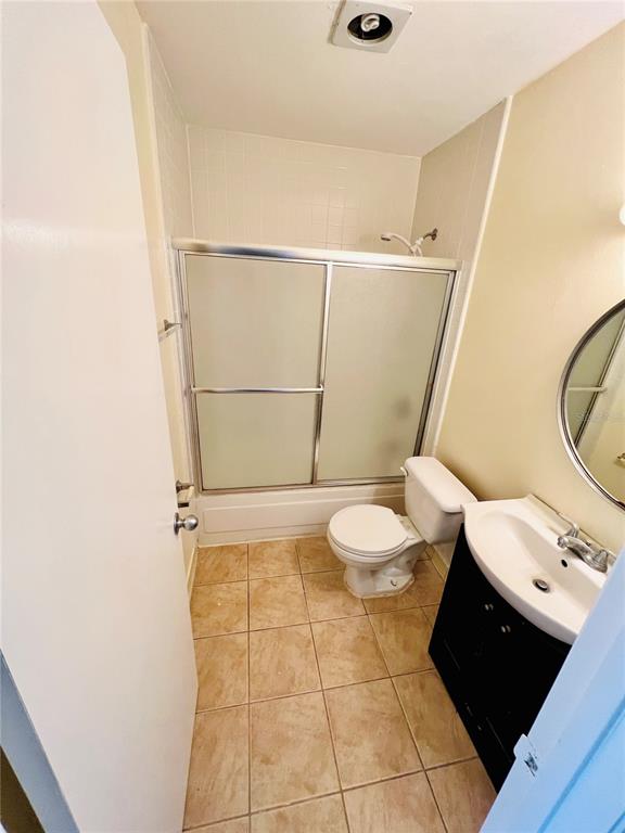 6057 Windhover Drive, Unit E08 Orlando, FL 32819 - Photo 12 of 21 a bathroom with a toilet and a shower