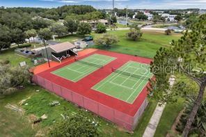 6057 Windhover Drive, Unit E08 Orlando, FL 32819 - Photo 21 of 21 an aerial view of a pool yard lake and outdoor seating